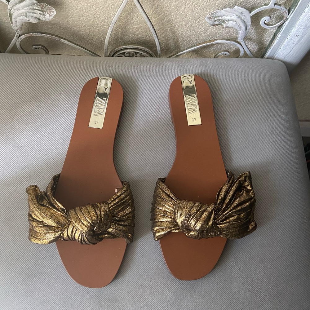 Zara gold bow slides. Size 37. Worn to try on only. Brand New.
